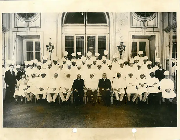 Escoffier's kitchen brigade at the Carlton Hotel, London, 1920 — the same organisational principle applied to the professional kitchen