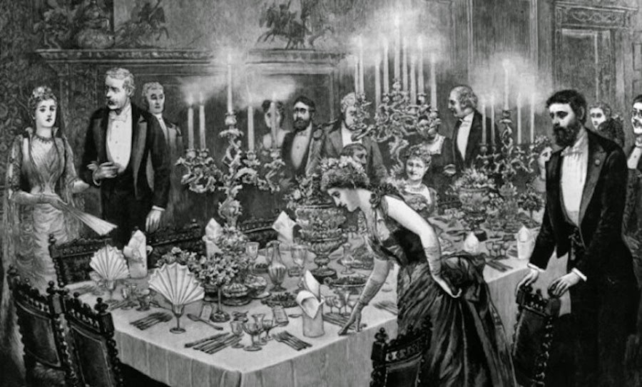 A formal Victorian dinner — many guests at elegantly set tables, the standard Escoffier's system made possible at scale